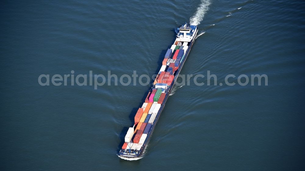 Aerial photograph Bonn - Sailing container ship on the river course of the Rhine in Bonn in the state North Rhine-Westphalia, Germany