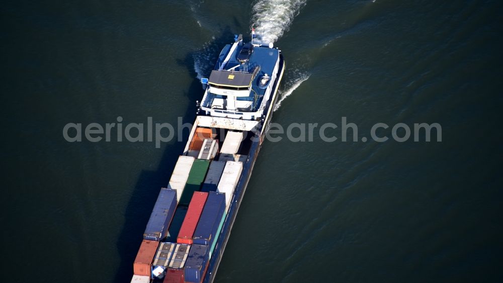 Bonn from the bird's eye view: Sailing container ship on the river course of the Rhine in Bonn in the state North Rhine-Westphalia, Germany