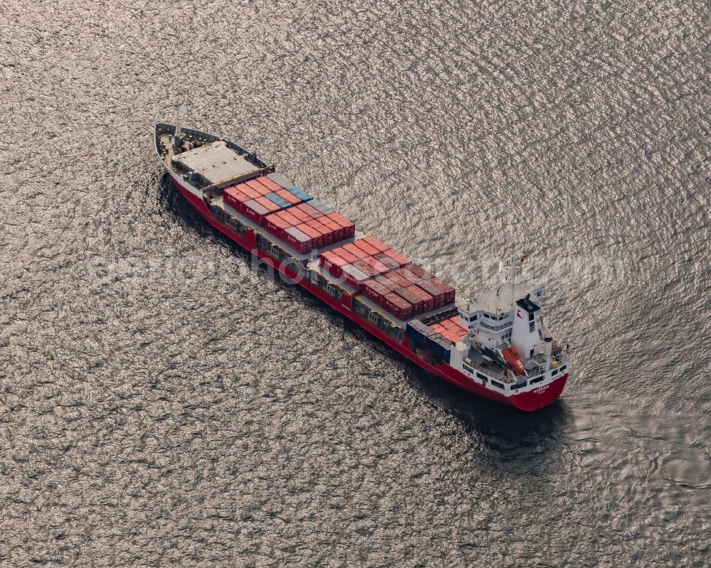 Aerial photograph Kiel - Travel of a container ship on the Kiel Fjord in front of the Holtenauer Reede in Kiel in the state Schleswig-Holstein, Germany. The cargo ship HJOeRDIS ( IMO 9126235 ) of the Finnish shipping company Langh Ship Oy Ab in waiting position in Holtenau