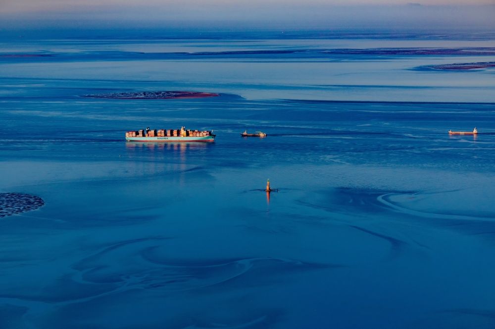 Butjadingen from the bird's eye view: Moving container ship Maribor Maersk in the Weser estuary in Butjadingen in the state Lower Saxony, Germany