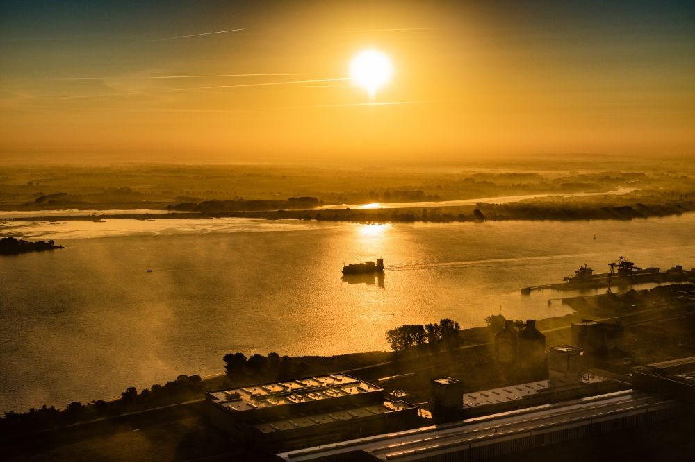 Aerial image Stade - Sailing container ship in fog Layer on Elbe river course in Drochtersen in the state Lower Saxony, Germany