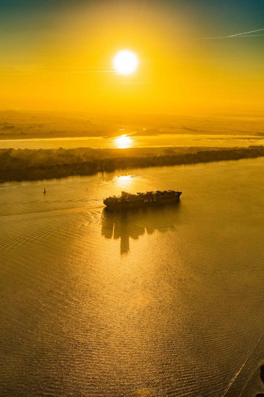 Aerial photograph Stade - Sailing container ship in fog Layer on Elbe river course in Drochtersen in the state Lower Saxony, Germany