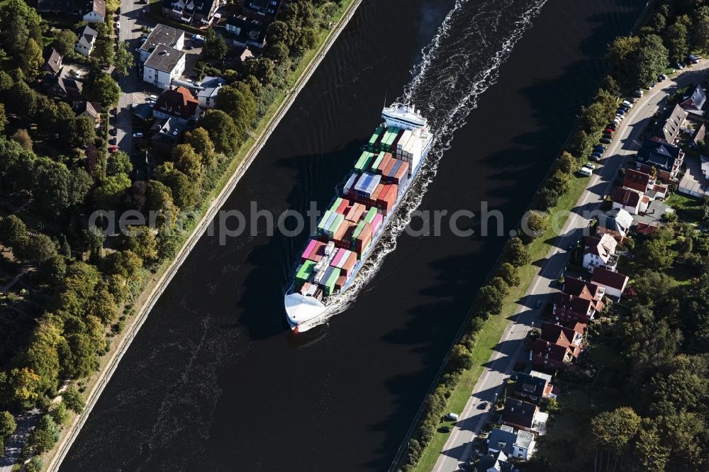Aerial image Rendsburg - Sailing container ship on Nord-Ostsee-Kanal in Rendsburg in the state Schleswig-Holstein, Germany