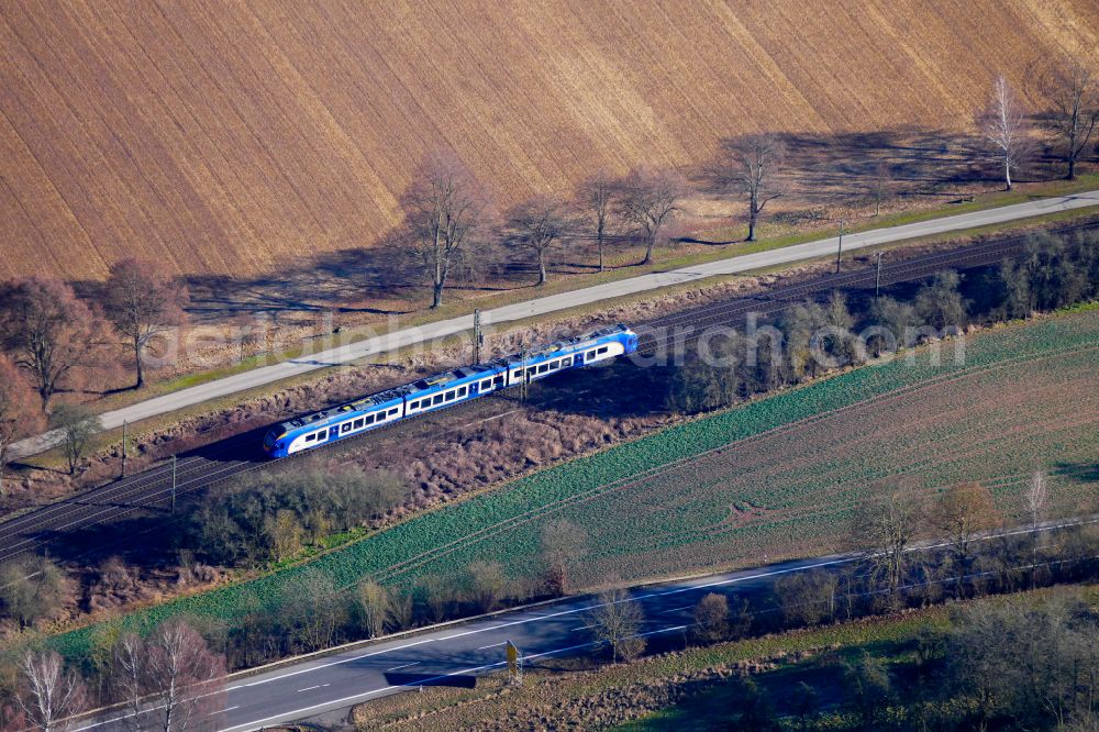 Eschwege from the bird's eye view: Driving a Cantus train on the track route on street B27 in Eschwege in the state Hesse, Germany