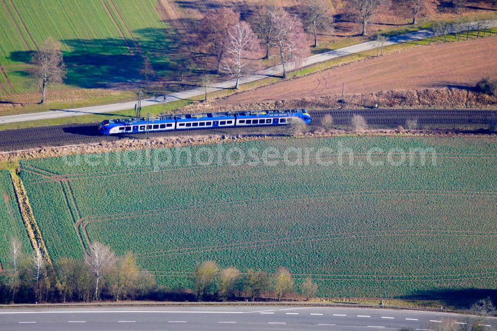 Aerial image Eschwege - Driving a Cantus train on the track route on street B27 in Eschwege in the state Hesse, Germany