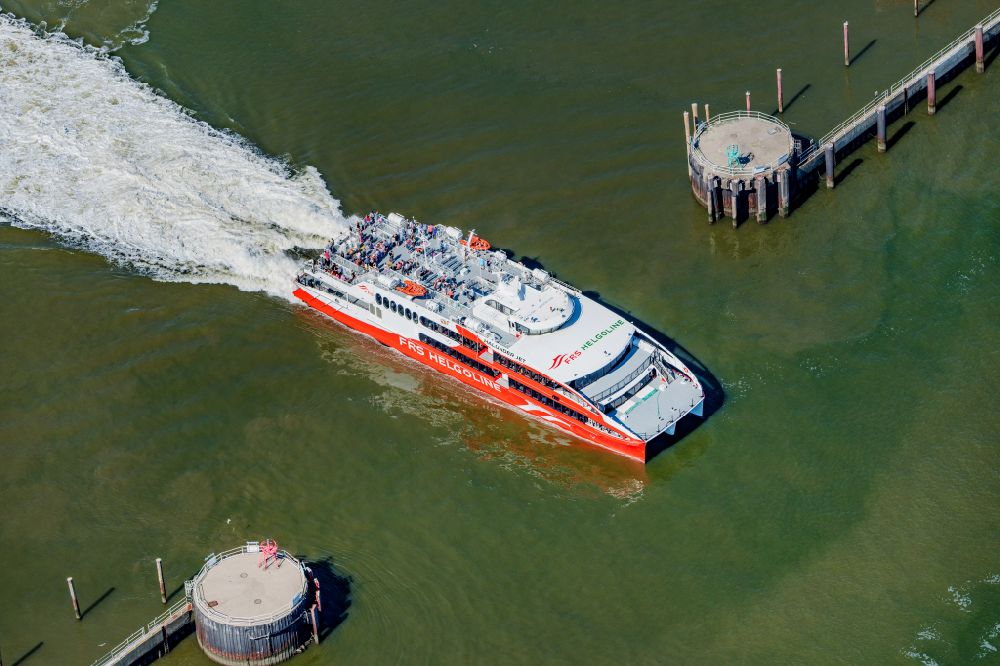 Aerial image Cuxhaven - Travel of a ferry ship Katamaran Halunder Jet der FRS Reederei in Cuxhaven habour in the state Lower Saxony, Germany