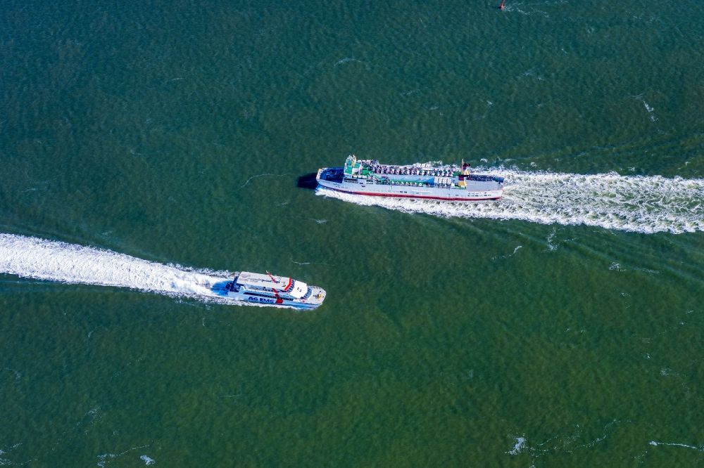 Borkum from the bird's eye view: Voyage of a ferry ship MS Westfalen in course encounter with the Katamaran Nordlicht on the water surface of the North Sea in Borkum in the state Lower Saxony, Germany
