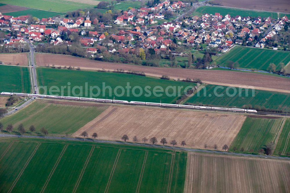 Aerial image Friedland - Driving a ICE train on the track route on street K30 in Friedland in the state Lower Saxony, Germany