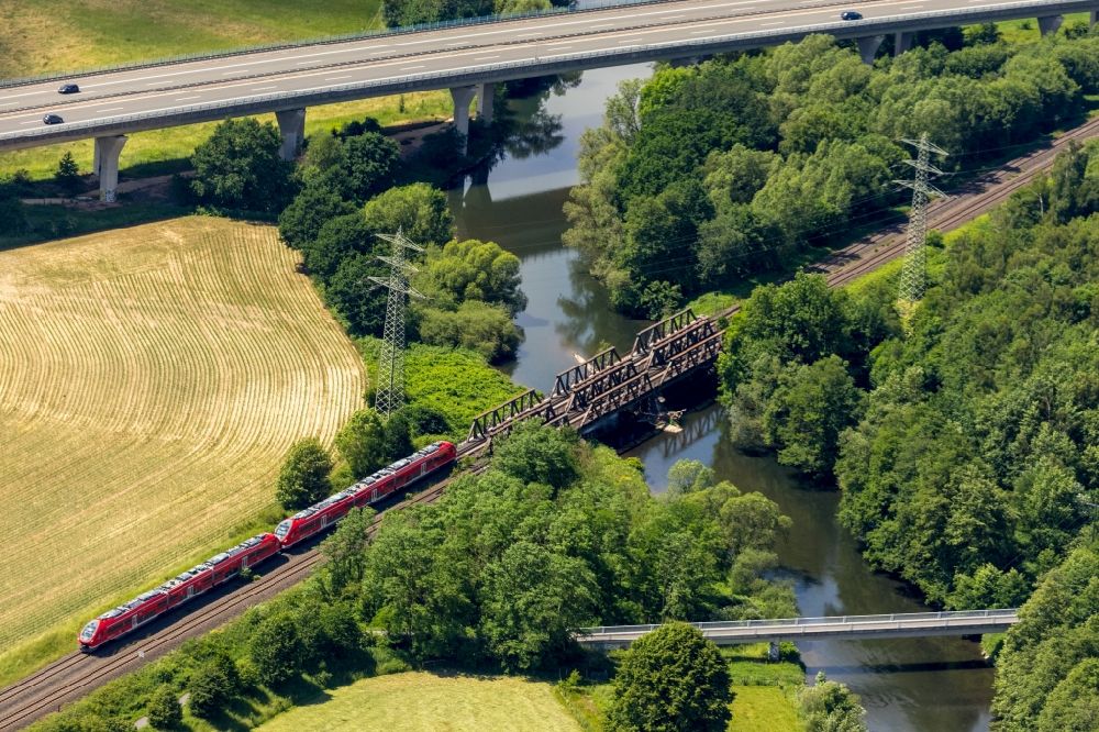 Aerial image Arnsberg - Ride a train on the track of Regional Express in the district Rumbeck in Arnsberg in the state North Rhine-Westphalia, Germany