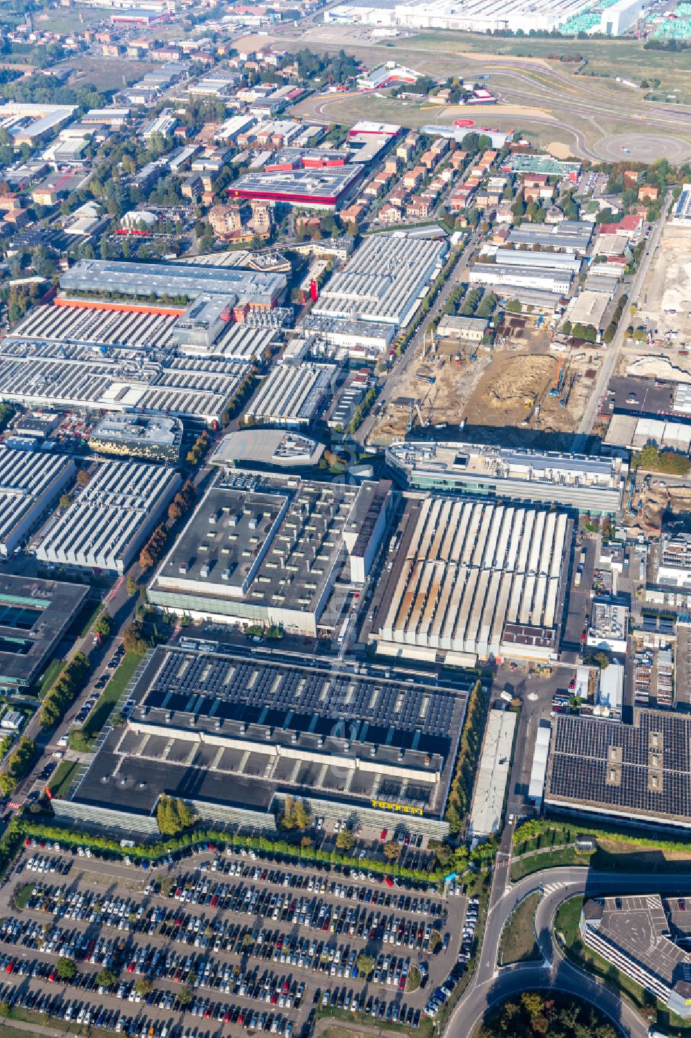 Aerial photograph Maranello - Buildings and production halls on the vehicle construction site Ferrari S.P.A. factory Maranello in Maranello in Emilia-Romagna, Italy