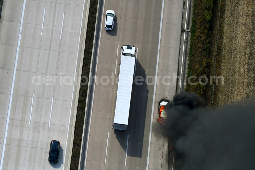 Aerial photograph Buchholz (Aller) - Smoke and flames from a motor vehicle fire in a passenger car on the A7 motorway in Buchholz (Aller) in the state Lower Saxony, Germany