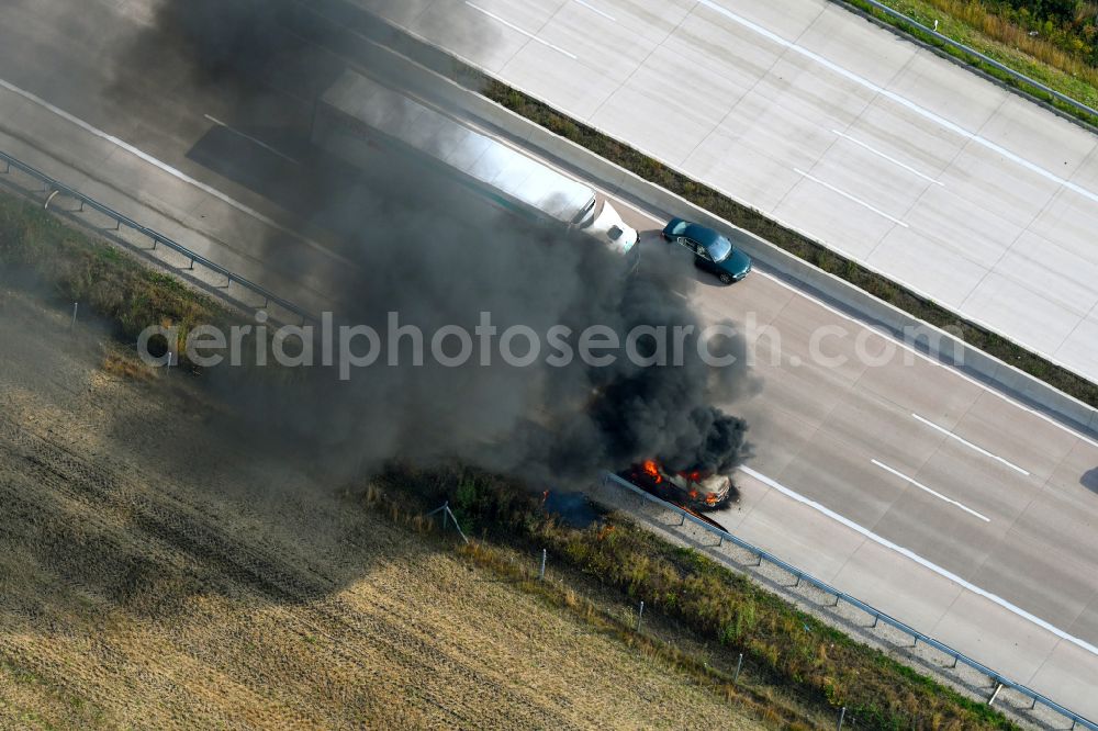 Buchholz (Aller) from above - Smoke and flames from a motor vehicle fire in a passenger car on the A7 motorway in Buchholz (Aller) in the state Lower Saxony, Germany