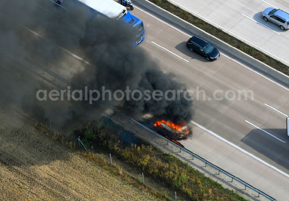 Aerial image Buchholz (Aller) - Smoke and flames from a motor vehicle fire in a passenger car on the A7 motorway in Buchholz (Aller) in the state Lower Saxony, Germany