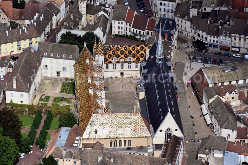 Aerial photograph Beaune - Facade of the monument Hotel-Dieu in Beaune in Bourgogne-Franche-Comte, France