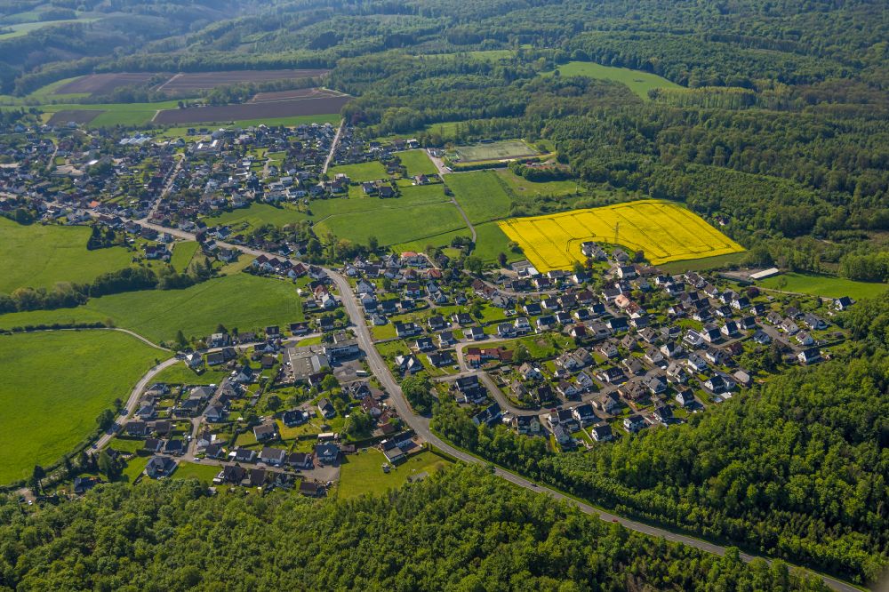 Arnsberg from above - Field landscape yellow flowering rapeseed flowers in the district Vosswinkel in Arnsberg at Sauerland in the state North Rhine-Westphalia, Germany