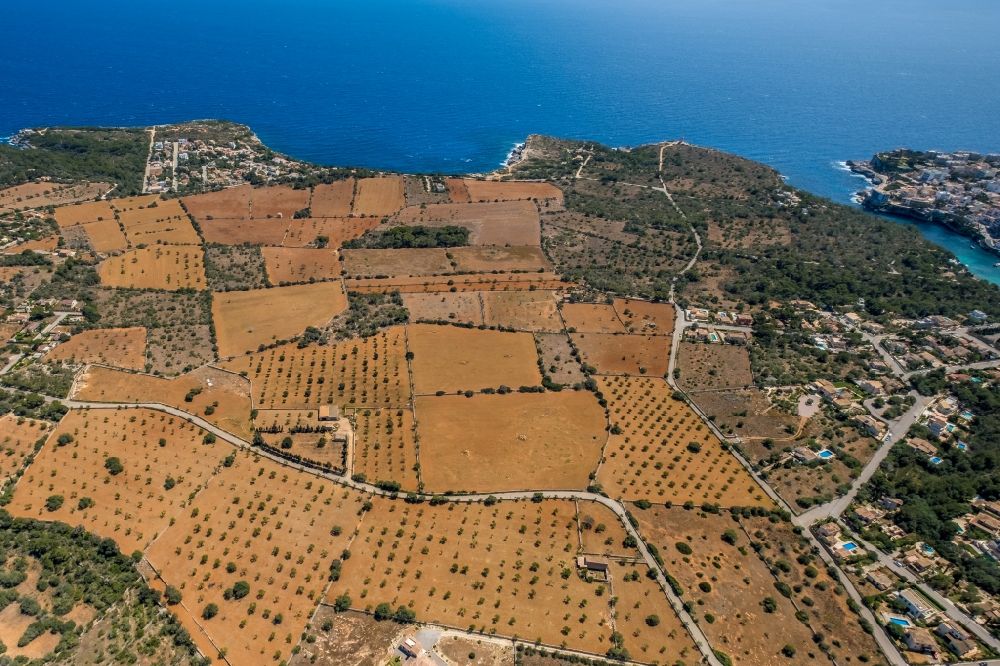 Santanyi from above - Agricultural fields with adjacent forest and forest areas on CamA? de sa Bassa Serra in Santanyi in Balearic island of Mallorca, Spain