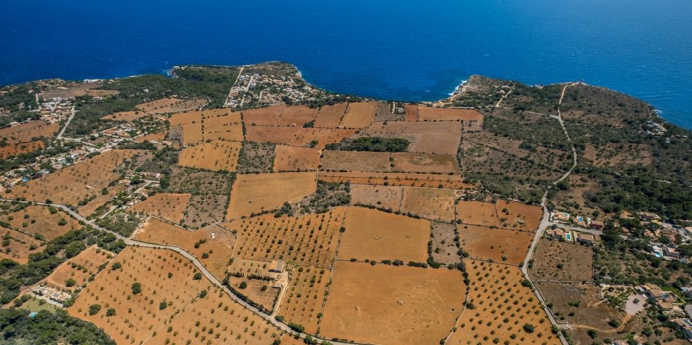 Santanyi from the bird's eye view: Agricultural fields with adjacent forest and forest areas on CamA? de sa Bassa Serra in Santanyi in Balearic island of Mallorca, Spain