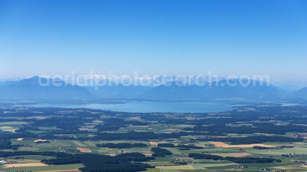 Aerial image Übersee - Rock massif and mountain landscape of the Alps surround Lake Chiemsee in Uebersee in the state of Bavaria, Germany