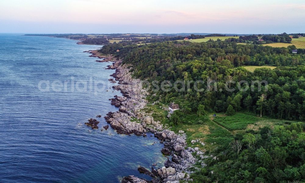 Östermarie Sogn from the bird's eye view: Rock Coastline on the cliffs of North Sea in Oestermarie Sogn on island bornholm in Region Hovedstaden, Denmark