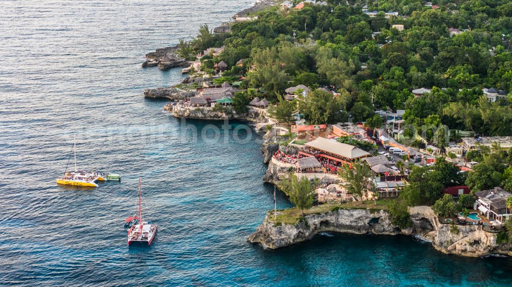 Aerial photograph Negril - Rock Coastline on the cliffs Rick's Cafe Negril in Negril in Westmoreland Parish, Jamaica