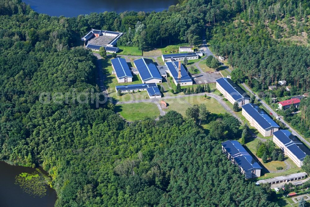 Kuhlmühle from above - Holiday home complex of the holiday park and former training center and pioneer camp of the GDR on Kuhlmuehler Strasse on the banks of the Grosser Baalsee in Kuhlmuehle in the state Brandenburg, Germany