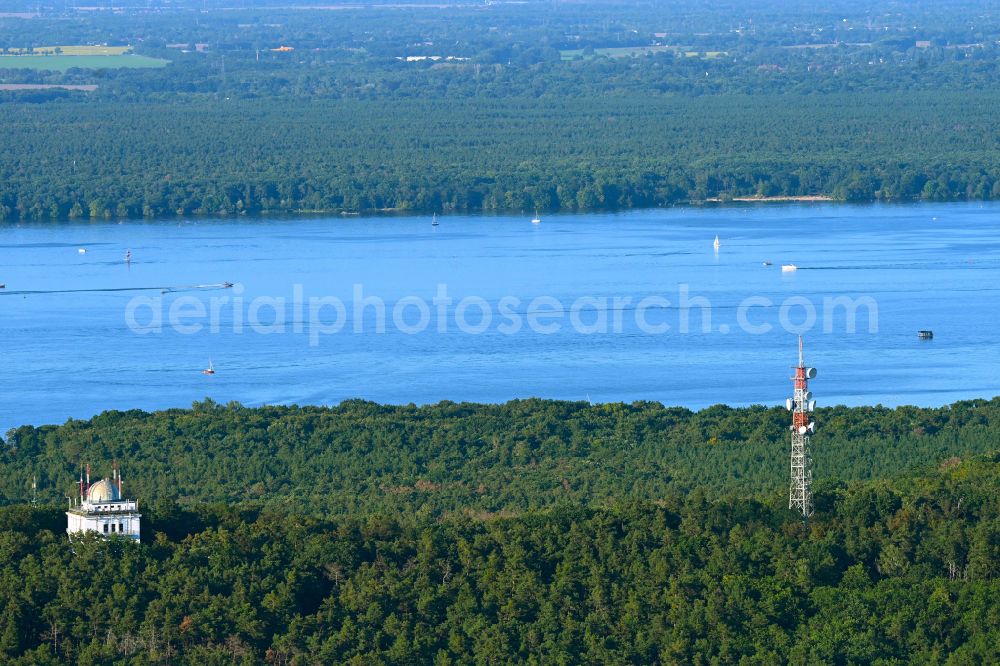 Aerial image Berlin - Telecommunications tower structure and television tower Mueggelberge with a view of the Mueggelsee on Mueggelheimer Damm in the Koepenick district in Berlin, Germany