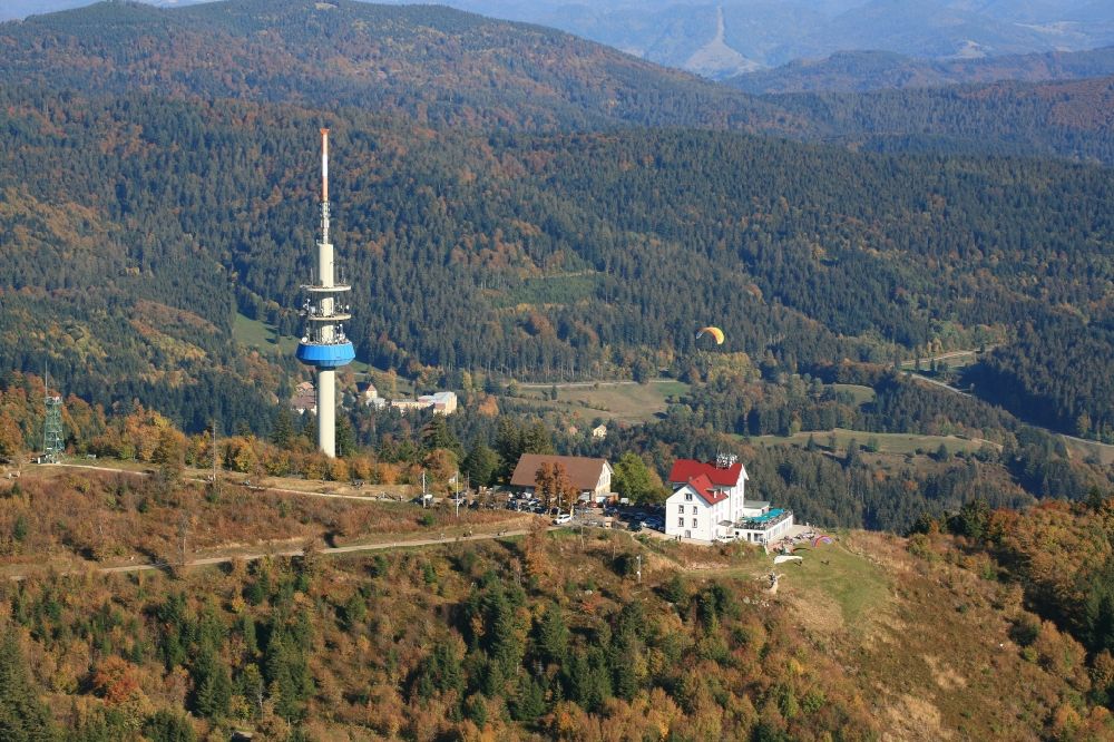 Schliengen from above - Mountainous landscape with summit of Hochblauen, television tower, hotel and take-off site for paraglider in the black Forest in Schliengen in the state Baden-Wurttemberg, Germany