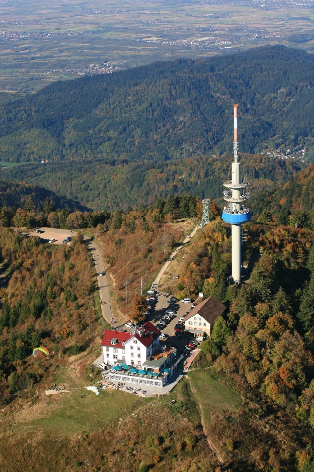 Aerial image Schliengen - Mountainous landscape with summit of Hochblauen, television tower, hotel and take-off site for paraglider in the black Forest in Schliengen in the state Baden-Wurttemberg, Germany