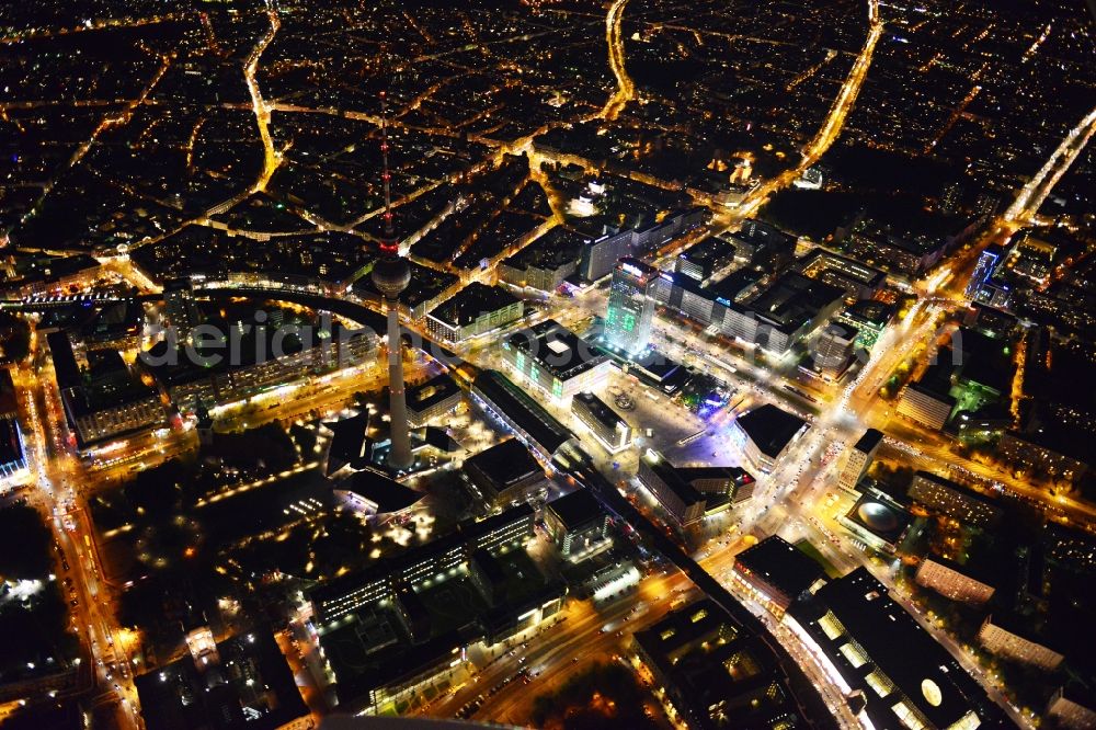 Aerial photograph Berlin - Night aerial view with an impressive view of the attractions of the annual Festival of Lights at Alexanderplatz in Berlin television tower in the city center of the capital, Berlin