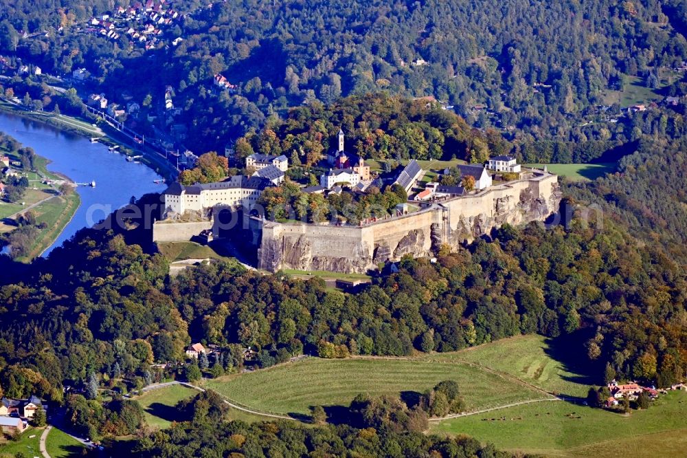 Königstein from above - The Fortress Koenigstein at the river Elbe in the county district of Saxon Switzerland East Erzgebirge in the state of Saxony. The fortress is one of the largest mountain fortresses in Europe and is located amidst the Elbe sand stone mountains on the flat top mountain of the same name