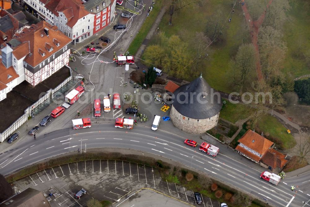 Aerial image Hann. Münden - Extinguishing action of the fire brigade at the source of the fire and smoke formation in an apartment building Aegidiiplatz corner Wallstrasse in Hann. Muenden in the state Lower Saxony, Germany