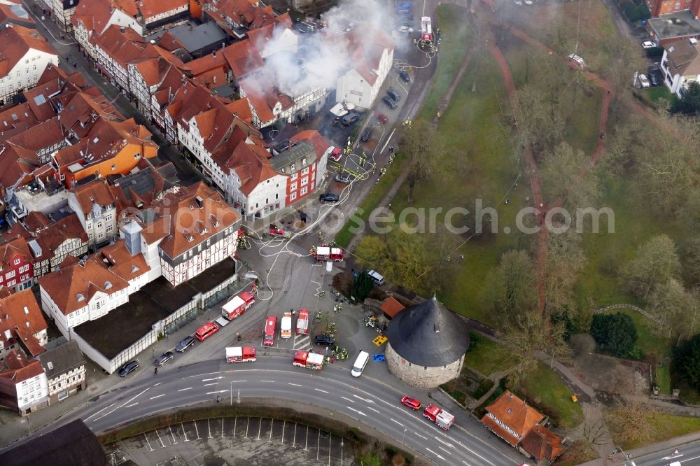 Aerial photograph Hann. Münden - Extinguishing action of the fire brigade at the source of the fire and smoke formation in an apartment building Aegidiiplatz corner Wallstrasse in Hann. Muenden in the state Lower Saxony, Germany