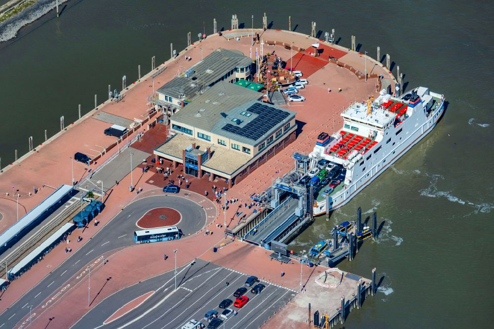 Aerial image Norden - Ferry port facilities on the sea coast of the North Sea with the ferry Frisia 4 in the district of Norddeich in Norden in the state of Lower Saxony, Germany