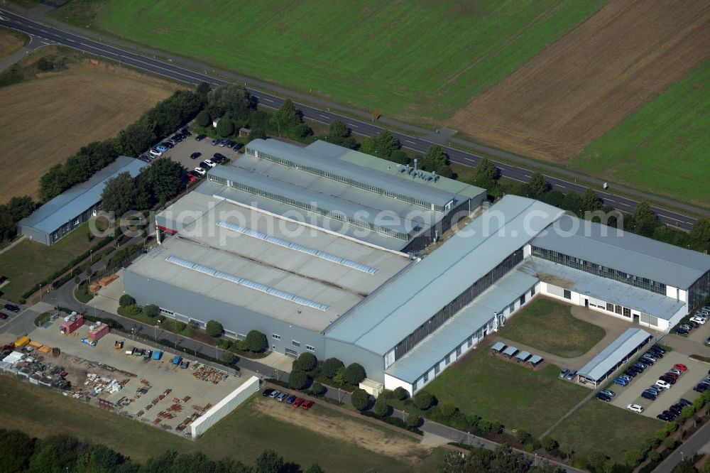 Aerial photograph Bad Düben - Company compound and building complex of Profiroll Technologies in Bad Dueben in the state of Saxony. The compound includes production halls and administrative buildings as well as a parking lot and is located on federal highway B2 in the West of the town