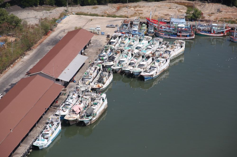 Ratsada from the bird's eye view: Fishing port of Ratsada on Phuket Island in Thailand. There are numerous fishing boats and ships in him. The port is also the starting point for ferries and excursion boats to neighboring islands