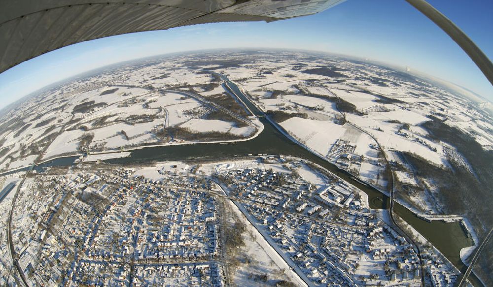 Aerial image Datteln - Fish eye Blick auf Binnenschiffahrt auf dem winterlich verschneiten und vereisten Mündung vom Wesel-Datteln-Kanal zum Dortmund-Ems-Kanal bei Datteln. Shipping on the snow-covered and icy Dortmund-Ems Canal.