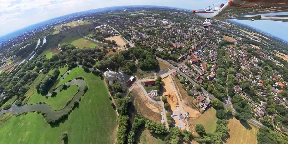 Hamm from above - Fisheye perspective residential area construction site of a mixed development with multi-family houses and single-family houses- New building at the castle mill and homestead - farm ruins at Muehlenteich in Hamm at Ruhrgebiet in the state North Rhine-Westphalia, Germany