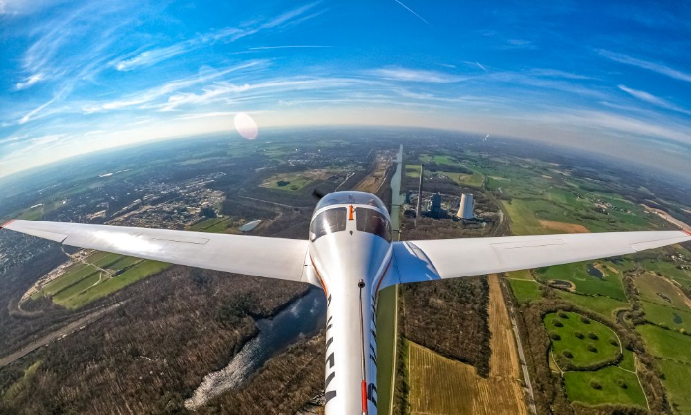 Bergkamen from the bird's eye view: Fisheye perspective motor glider Diamond HK36 Super Dimona Aircraft in flight over the airspace in Bergkamen at Ruhrgebiet in the state North Rhine-Westphalia, Germany