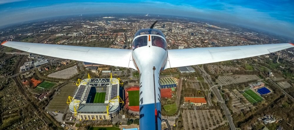 Aerial photograph Dortmund - Fisheye perspective motor glider Aircraft in flight over the airspace of Arena des BVB - Stadion Signal Iduna Park in Dortmund in the state North Rhine-Westphalia, Germany