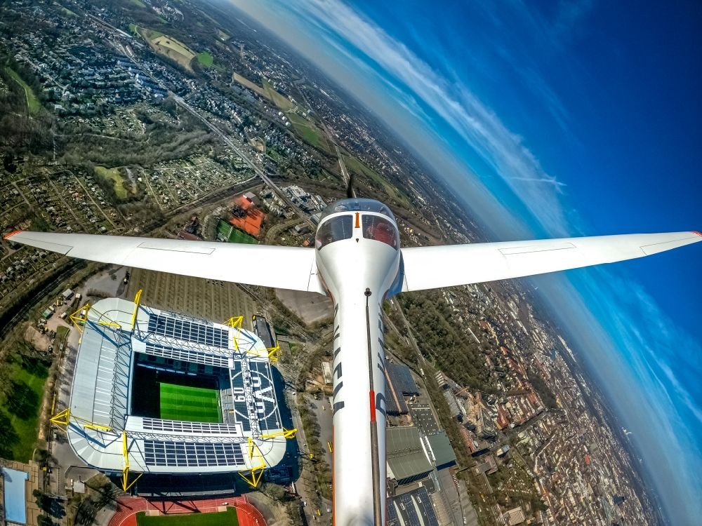 Dortmund from the bird's eye view: Fisheye perspective motor glider Aircraft in flight over the airspace of Arena des BVB - Stadion Signal Iduna Park in Dortmund in the state North Rhine-Westphalia, Germany