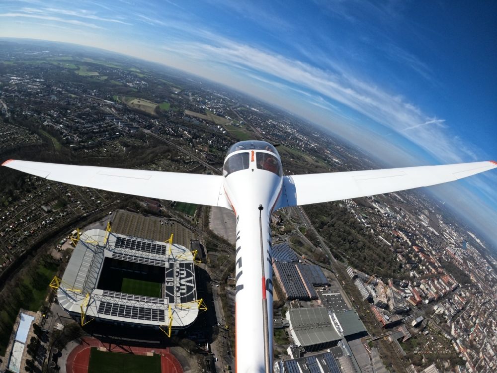 Dortmund from above - Fisheye perspective motor glider Aircraft in flight over the airspace of Arena des BVB - Stadion Signal Iduna Park in Dortmund in the state North Rhine-Westphalia, Germany
