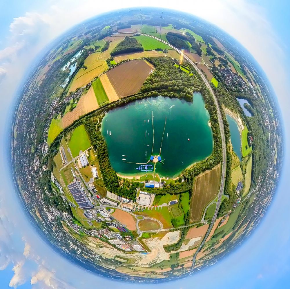 Beckum from the bird's eye view: Fisheye perspective leisure facility with a water ski cable car Park am Tuttenbrocksee in Beckum in the federal state of North Rhine-Westphalia, Germany