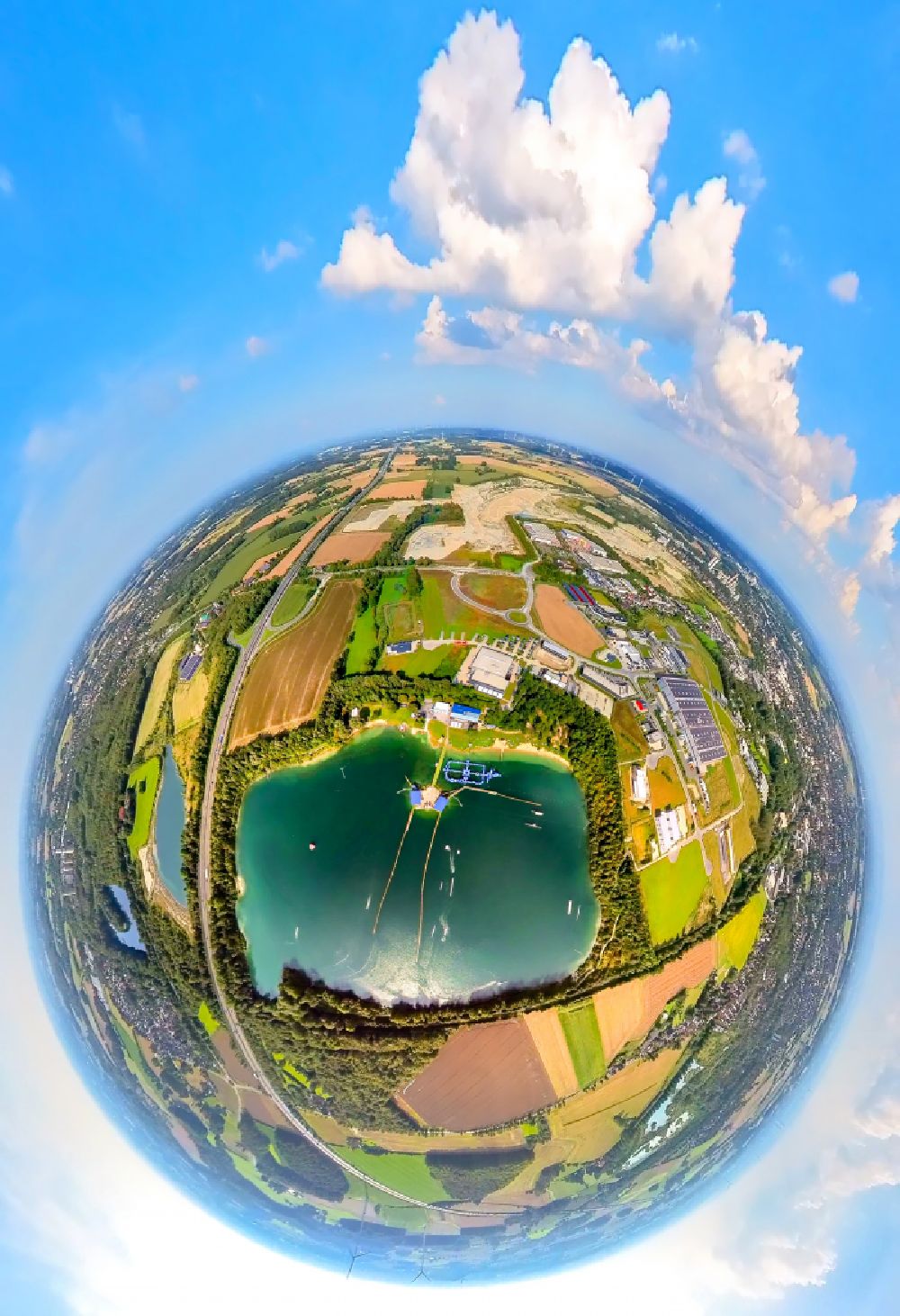 Beckum from above - Fisheye perspective leisure facility with a water ski cable car Park am Tuttenbrocksee in Beckum in the federal state of North Rhine-Westphalia, Germany