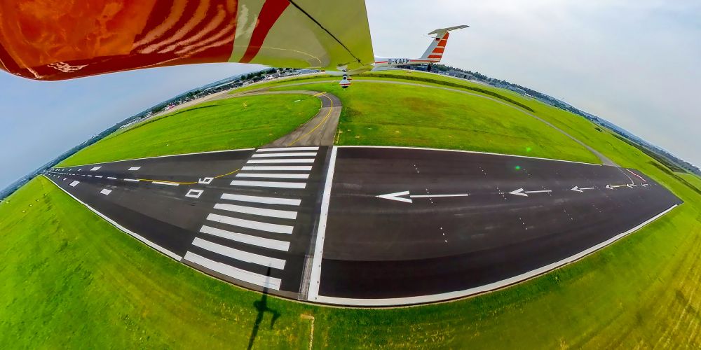 Dortmund from the bird's eye view: Fisheye perspective runway with hangar taxiways and terminals on the grounds of the airport on street Flughafenring in Dortmund at Ruhrgebiet in the state North Rhine-Westphalia, Germany