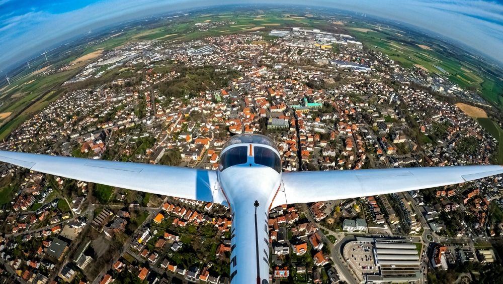 Werl from above - Fisheye perspective motor glider of typ Dimona Aircraft call sign D-KAFM in flight over the airspace in Werl in the state North Rhine-Westphalia, Germany