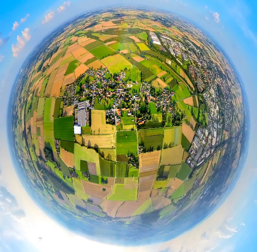 Sönnern from above - Fisheye perspective village view on the edge of agricultural fields and land in Soennern in the state North Rhine-Westphalia, Germany
