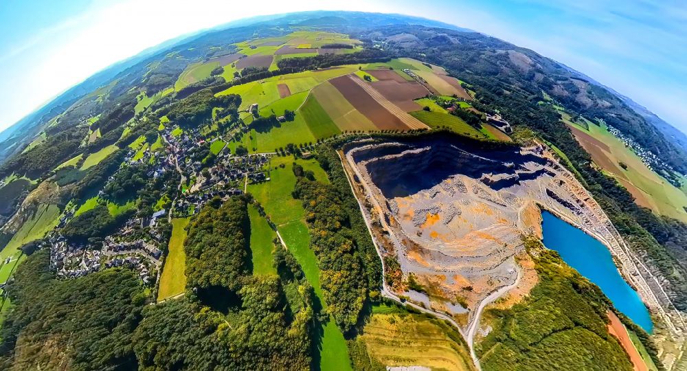 Eisborn from the bird's eye view: Fisheye perspective quarry for the mining and handling of limestone in Eisborn in the state North Rhine-Westphalia, Germany