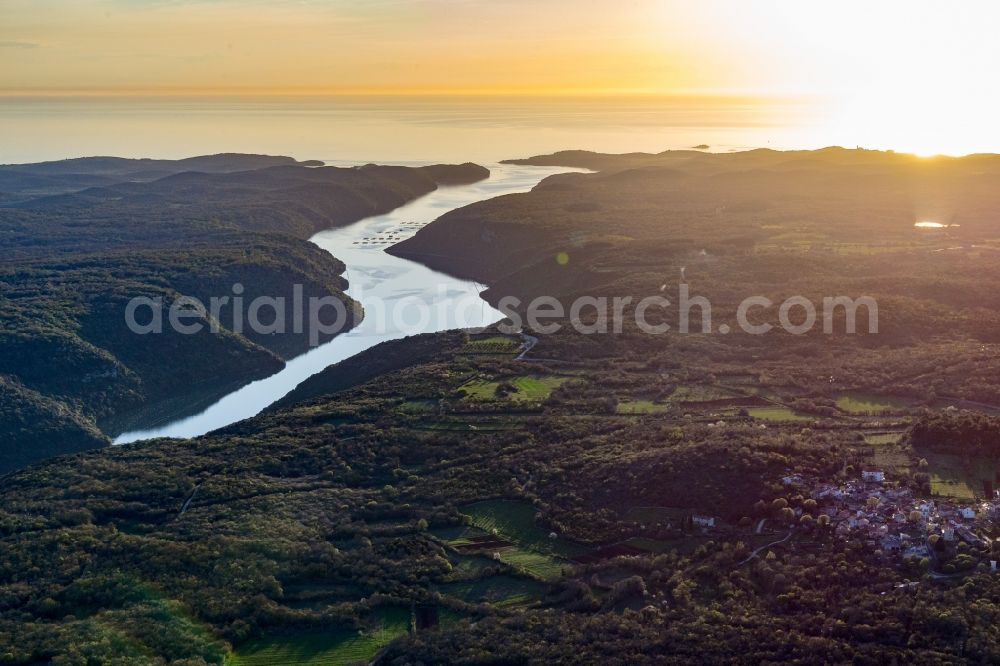 Aerial image Klostar - Fjords with lake and valley in the mountain landscape of Limski Fjord in Klostar in Istirien - Istarska zupanija, Croatia