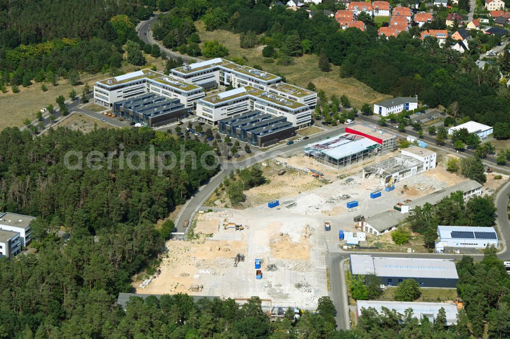 Berlin from above - Construction site for surface demolition and unsealing work to expand the production site of the German Institute for Cell and Tissue Replacement gGmbH in the Innovation Park Wuhlheide (IPW) in Berlin, Germany