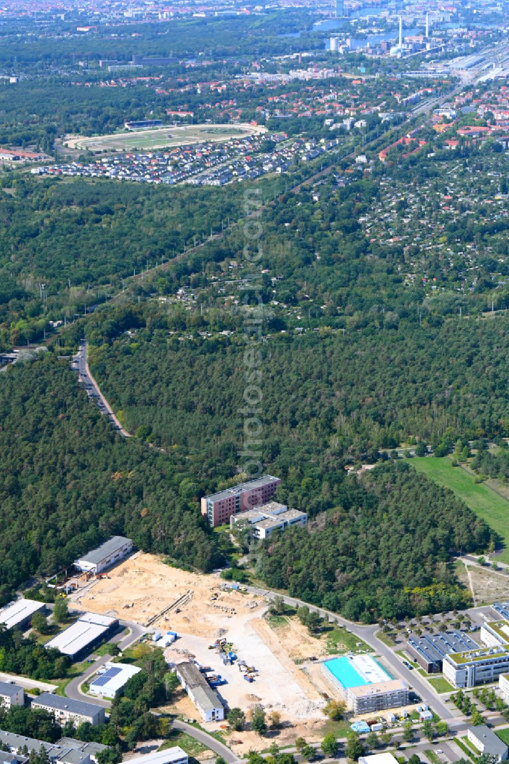 Aerial photograph Berlin - Construction site for surface demolition and unsealing work to expand the production site of the German Institute for Cell and Tissue Replacement gGmbH in the Innovation Park Wuhlheide (IPW) in Berlin, Germany